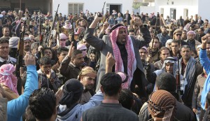 Residents gather to protest near the house of Alwani, in Ramadi